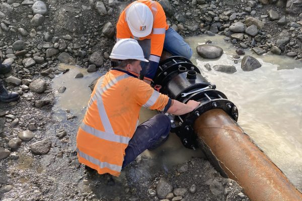 Workers Implementing the Tauherenikau River Pipe Fitting Repair Work